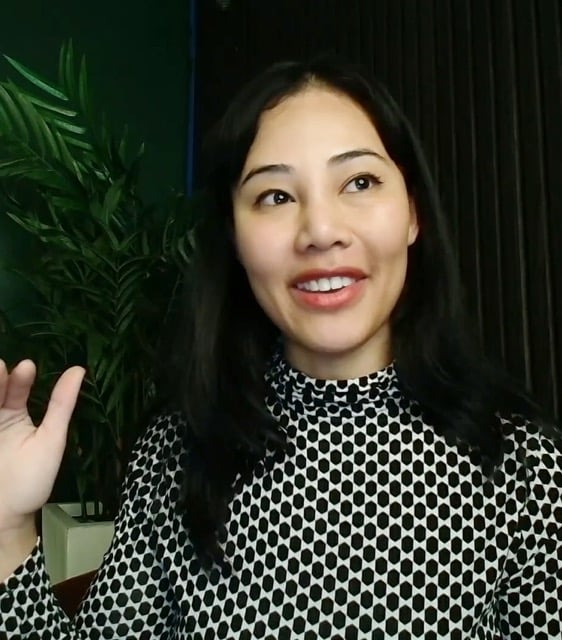 Professional collaborating with earbuds against a bamboo background